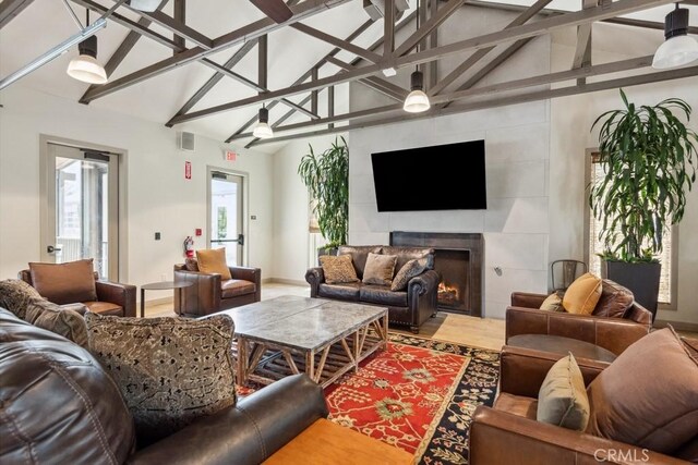 2785 Berry Loop Privado Unit 12, Ontario, CA 91761 - living room with a fireplace, beamed ceiling, and high vaulted ceiling