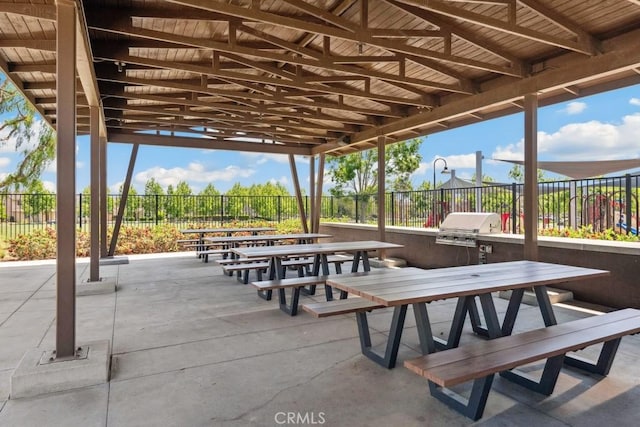 2785 Berry Loop Privado Unit 12, Ontario, CA 91761 - view of community with fence, a patio area, outdoor dining area, and exterior kitchen