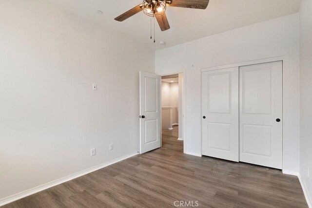 2785 Berry Loop Privado Unit 12, Ontario, CA 91761 - unfurnished bedroom with wood finished floors, baseboards, a closet, and ceiling fan