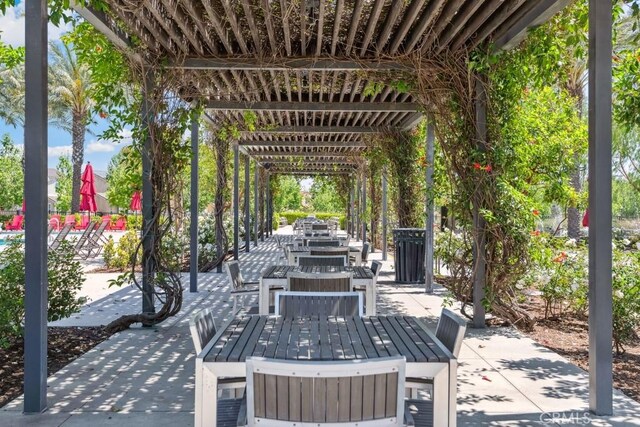 2785 Berry Loop Privado Unit 12, Ontario, CA 91761 - view of patio featuring outdoor dining area and a pergola