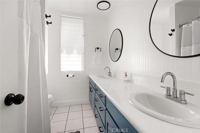 5875 Doverwood Dr Unit 309, Culver City, CA 90230 - bathroom featuring tile patterned floors, double vanity, toilet, and baseboards