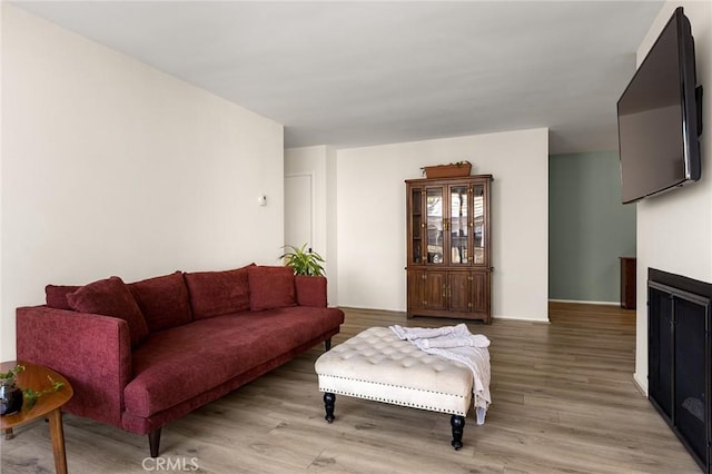 5875 Doverwood Dr Unit 309, Culver City, CA 90230 - living room featuring light wood-style floors and a fireplace