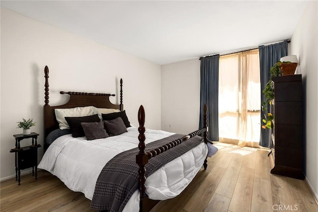 5875 Doverwood Dr Unit 309, Culver City, CA 90230 - bedroom featuring light wood-type flooring and baseboards