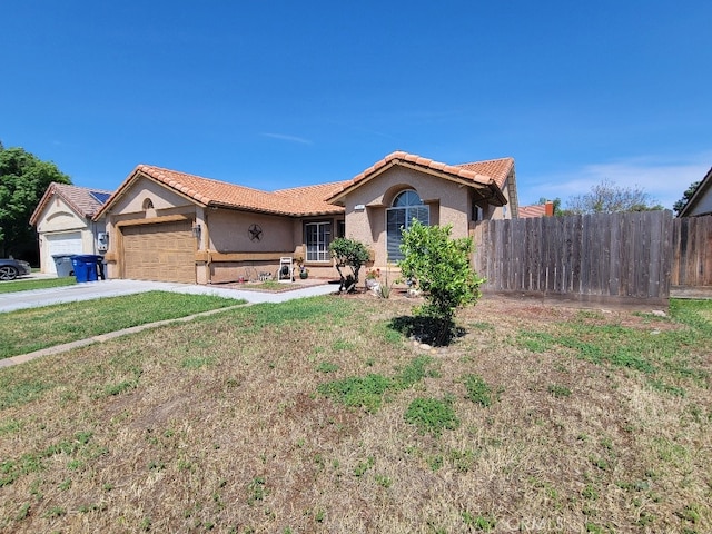 628 Vintner St, Los Banos, CA 93635 - ranch-style house featuring a tile roof, fence, and stucco siding