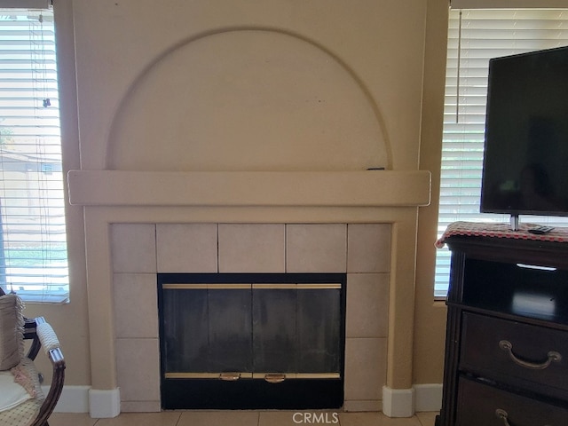 628 Vintner St, Los Banos, CA 93635 - room details with baseboards and a fireplace