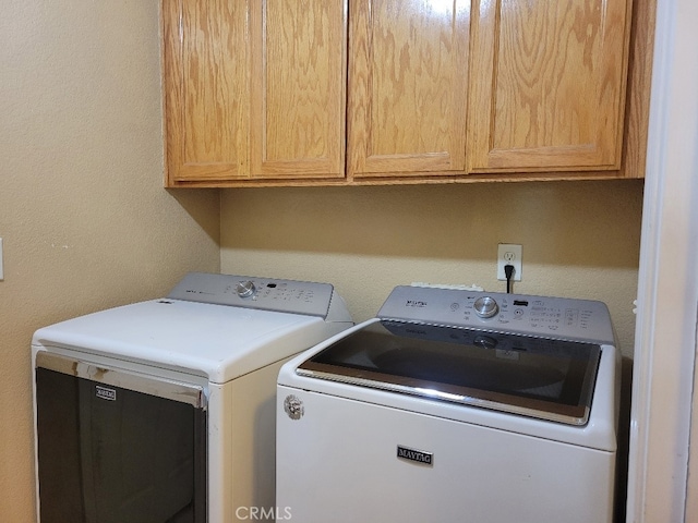 628 Vintner St, Los Banos, CA 93635 - laundry area featuring washing machine and dryer and cabinet space