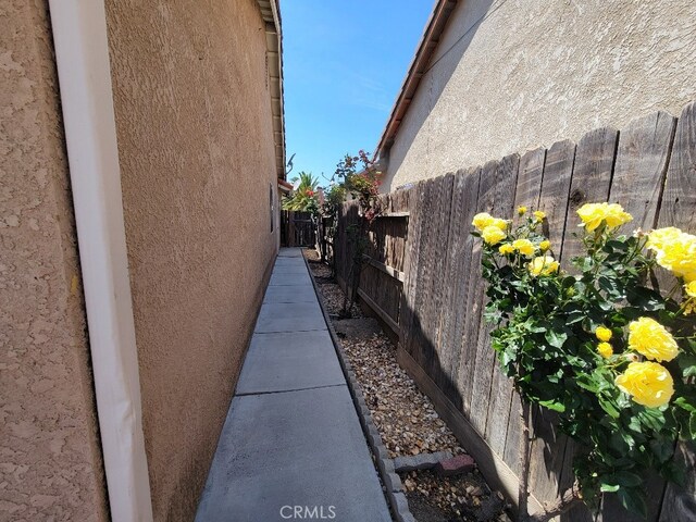 628 Vintner St, Los Banos, CA 93635 - view of home's exterior with fence and stucco siding