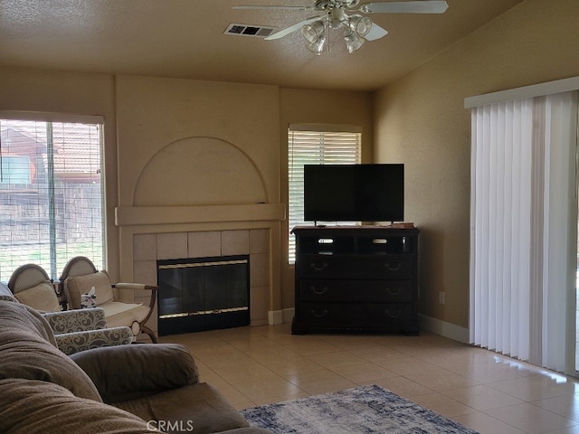 628 Vintner St, Los Banos, CA 93635 - living room with light tile patterned floors, ceiling fan, visible vents, and plenty of natural light