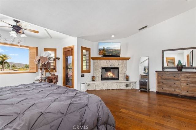 22255 Village Way Dr, Canyon Lake, CA 92587 - bedroom featuring wood-type flooring, a stone fireplace, lofted ceiling, ceiling fan, and recessed lighting