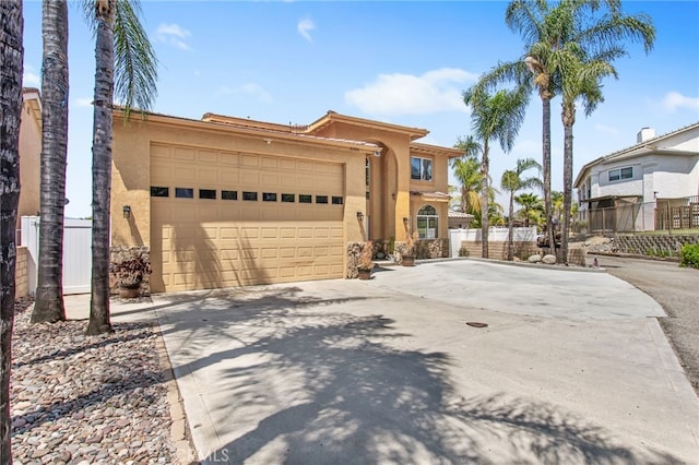 22255 Village Way Dr, Canyon Lake, CA 92587 - view of side of home featuring stucco siding, driveway, a garage, and fence