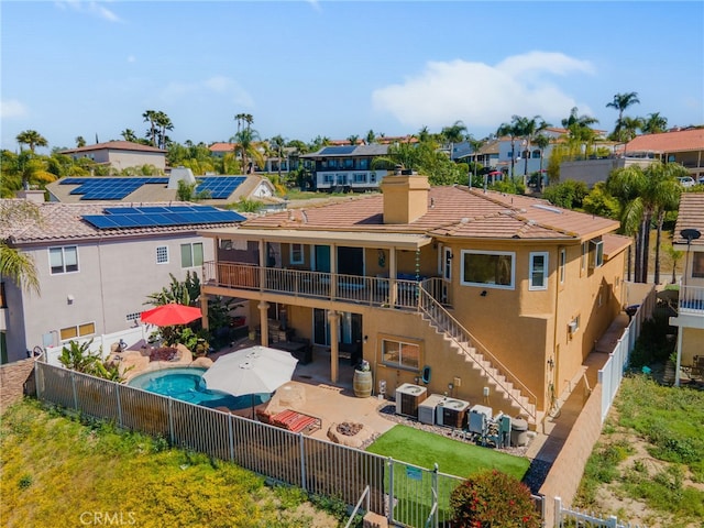 22255 Village Way Dr, Canyon Lake, CA 92587 - rear view of property with a fenced backyard, a patio, a chimney, a residential view, and stucco siding