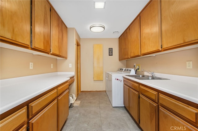 22255 Village Way Dr, Canyon Lake, CA 92587 - laundry room featuring cabinet space, washer and clothes dryer, light tile patterned floors, and baseboards