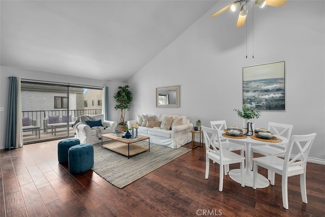 living area with ceiling fan, baseboards, high vaulted ceiling, and wood finished floors