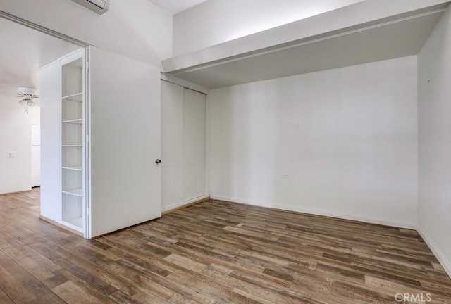 empty room with dark wood-style flooring