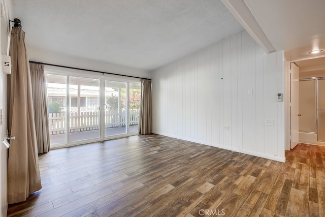 empty room featuring wood finished floors