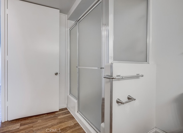 full bathroom with wood finished floors