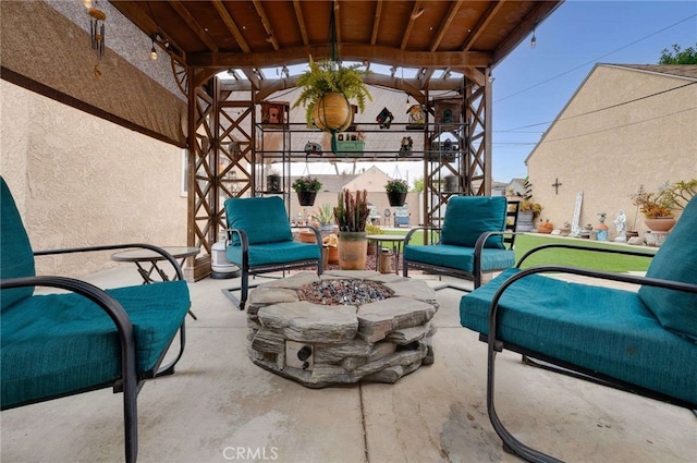 view of patio / terrace with a fire pit