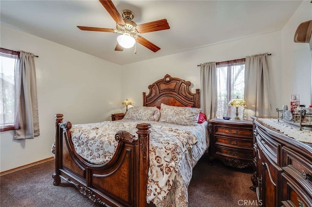 bedroom featuring baseboards, a ceiling fan, and dark carpet