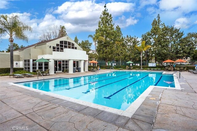 community pool with a patio