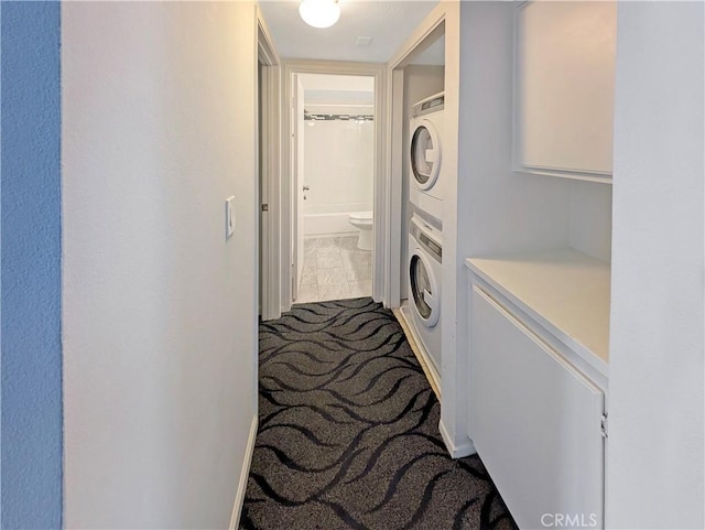 26770 Claudette St Unit 408, Canyon Country, CA 91351 - clothes washing area featuring stacked washer / dryer and laundry area