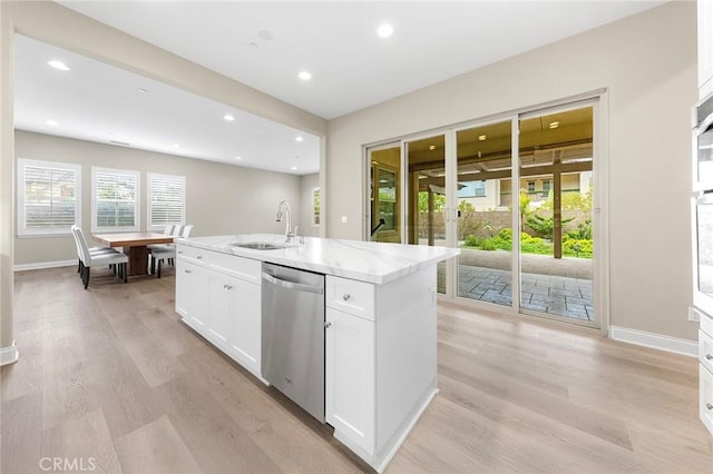 5467 Lisboa St, Chino Hills, CA 91709 - kitchen featuring stainless steel dishwasher, a sink, baseboards, white cabinetry, and light stone countertops