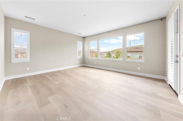 5467 Lisboa St, Chino Hills, CA 91709 - unfurnished bedroom with light wood finished floors, multiple windows, and baseboards