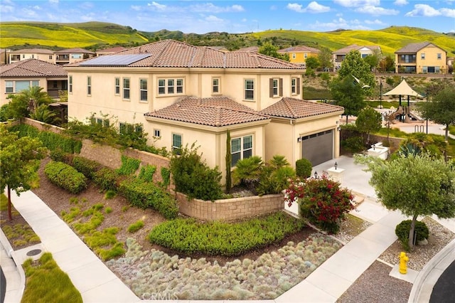 5467 Lisboa St, Chino Hills, CA 91709 - mediterranean / spanish house featuring stucco siding, a tile roof, a mountain view, and a residential view