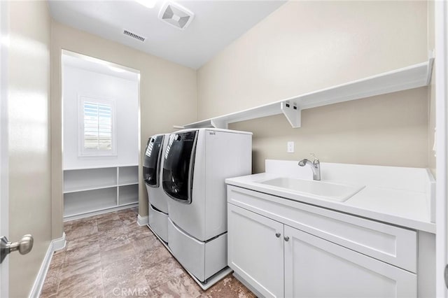 5467 Lisboa St, Chino Hills, CA 91709 - clothes washing area featuring separate washer and dryer, cabinet space, and baseboards