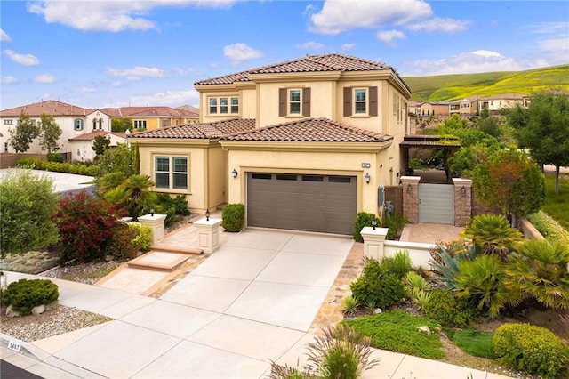 5467 Lisboa St, Chino Hills, CA 91709 - mediterranean / spanish home featuring stucco siding, concrete driveway, a tiled roof, and a residential view