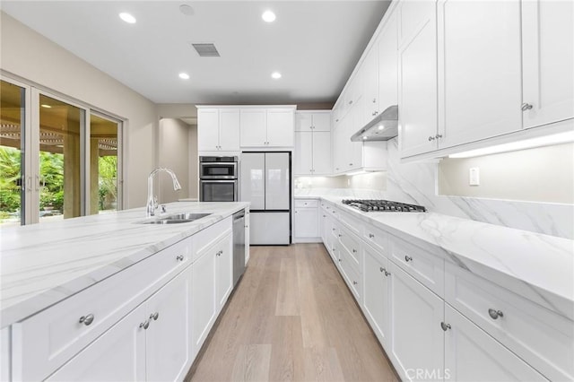 5467 Lisboa St, Chino Hills, CA 91709 - kitchen featuring a sink, appliances with stainless steel finishes, under cabinet range hood, recessed lighting, and white cabinetry