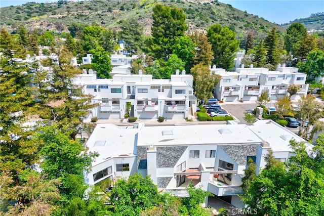 aerial view of residential area featuring a mountainous background