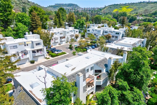 aerial view of residential area featuring mountains