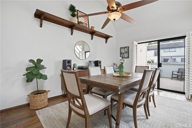 dining area featuring light wood finished floors, ceiling fan, and lofted ceiling