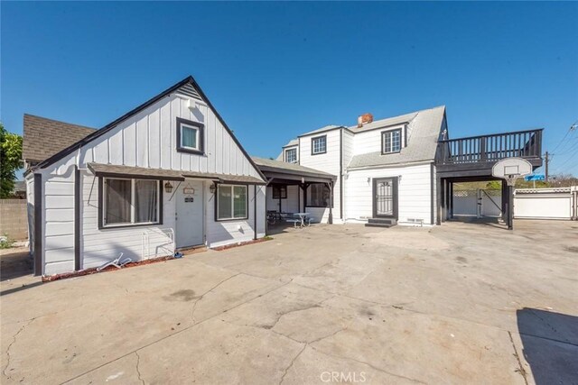 1949 Lancewood Ave, Hacienda Heights, CA 91745 - view of front of house featuring board and batten siding, fence, and a shingled roof