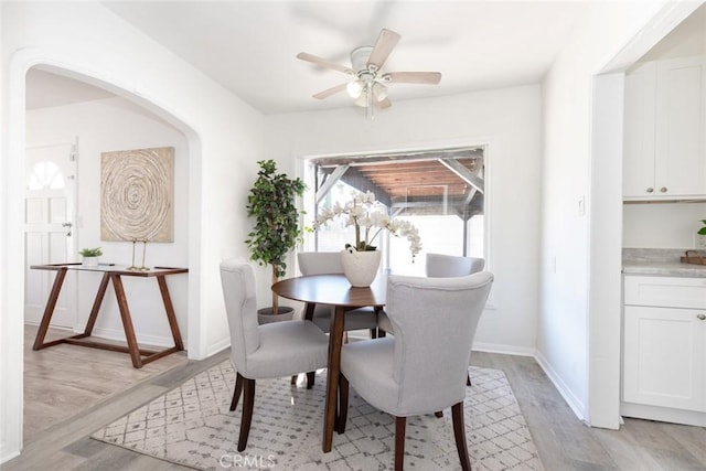 1949 Lancewood Ave, Hacienda Heights, CA 91745 - dining area with light wood-type flooring, ceiling fan, baseboards, and arched walkways