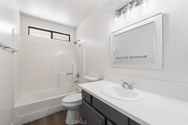 bathroom with shower / bath combination, vanity, toilet, and wood finished floors