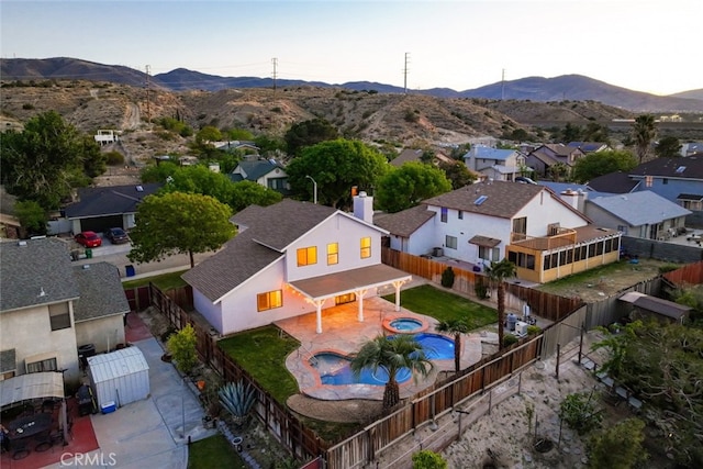birds eye view of property featuring a mountain view and a residential view