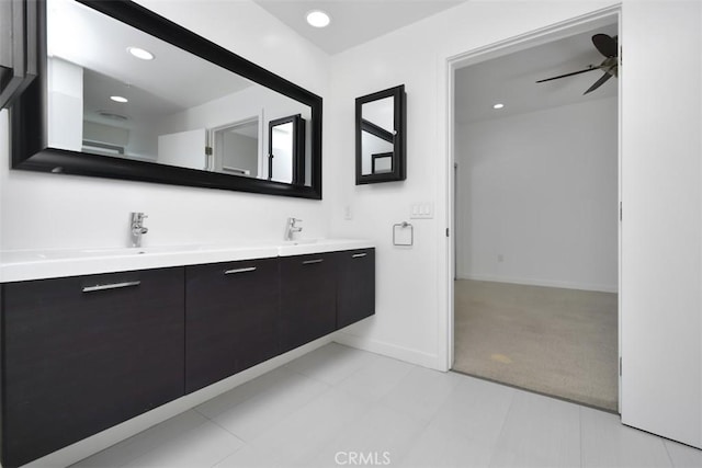 bathroom featuring recessed lighting, baseboards, ceiling fan, a sink, and double vanity