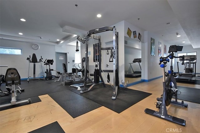 workout area featuring baseboards and recessed lighting