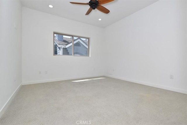 carpeted empty room with baseboards, ceiling fan, and recessed lighting