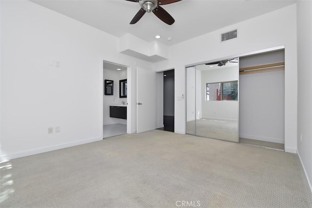 unfurnished bedroom featuring carpet flooring, visible vents, baseboards, and recessed lighting
