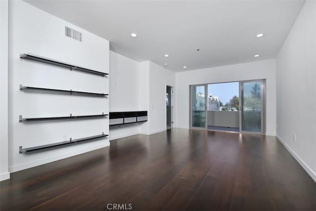 unfurnished living room with baseboards, visible vents, recessed lighting, and wood finished floors