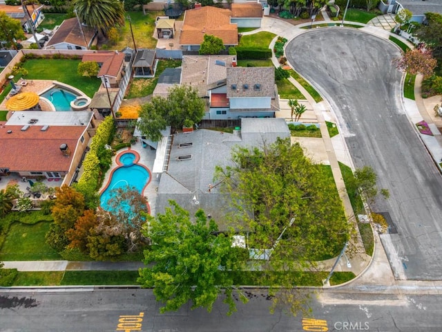 birds eye view of property with a residential view