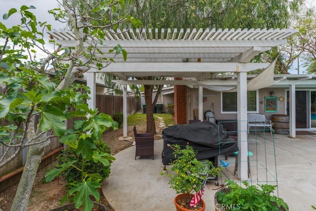view of patio / terrace with a pergola and a fenced backyard