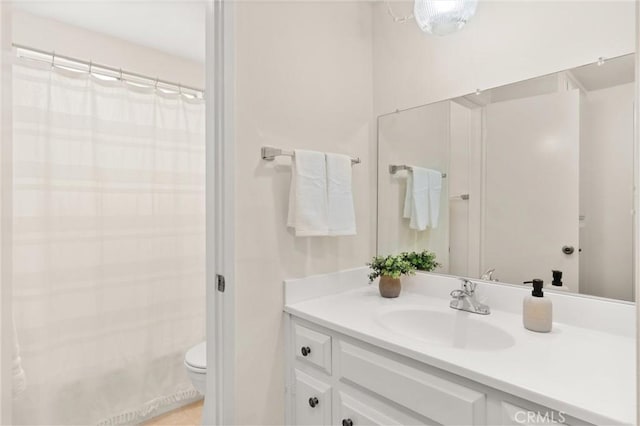 660 Stanley Ave, Long Beach, CA 90814 - bathroom with tile patterned floors, toilet, a shower with shower curtain, and vanity