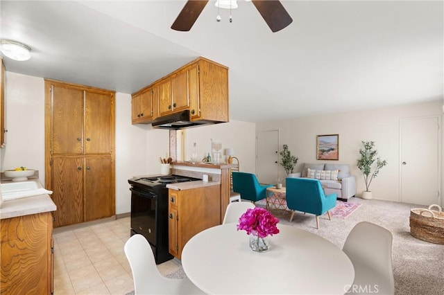 660 Stanley Ave, Long Beach, CA 90814 - kitchen with a ceiling fan, brown cabinetry, black / electric stove, open floor plan, and light countertops