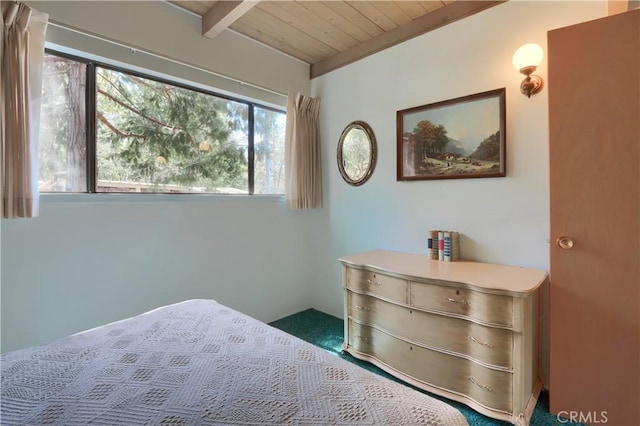 60027 Cascadel Dr S, North Fork, CA 93643 - carpeted bedroom featuring wood ceiling with exposed beams