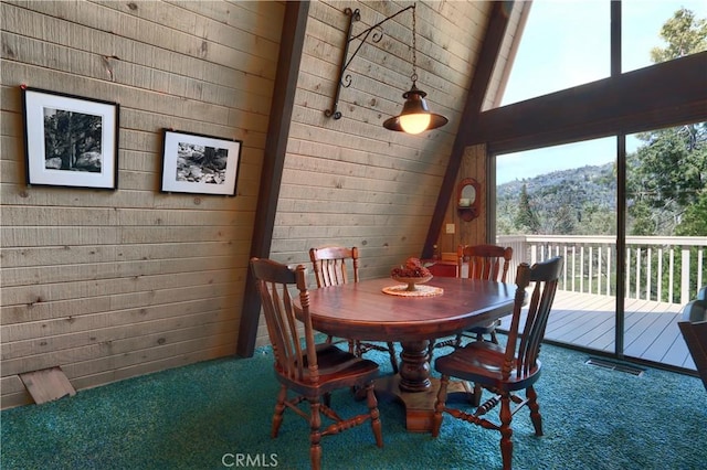 60027 Cascadel Dr S, North Fork, CA 93643 - dining space featuring carpet flooring, plenty of natural light, and high vaulted ceiling