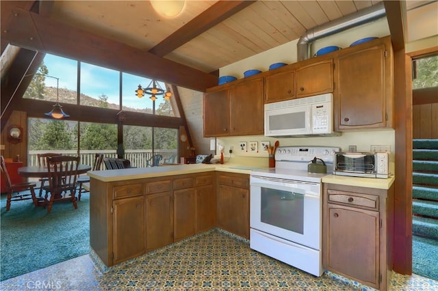 60027 Cascadel Dr S, North Fork, CA 93643 - kitchen with white appliances, light countertops, a peninsula, brown cabinets, and wood ceiling with exposed beams