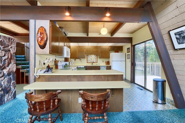 60027 Cascadel Dr S, North Fork, CA 93643 - kitchen featuring white appliances, light countertops, a sink, a peninsula, and wooden ceiling with exposed beams